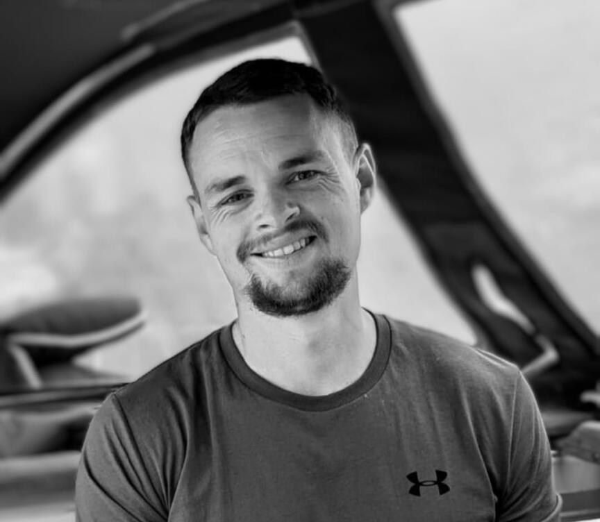 Agent2 Founder Picture of man smiling directly at the camera wearing a tshirt.